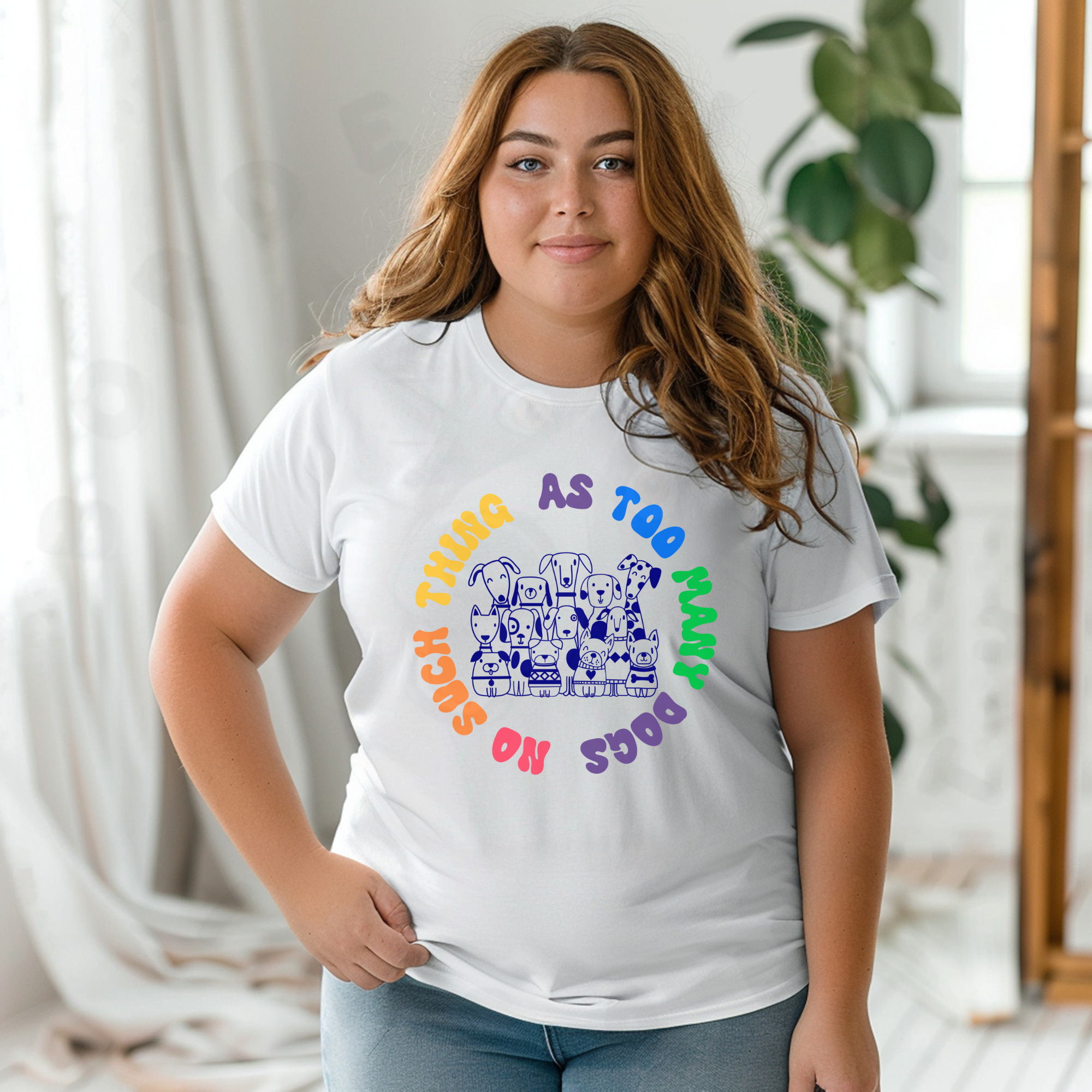 white shirt with illustration of many dogs and rainbow text that says “No such thing as too many dogs.”