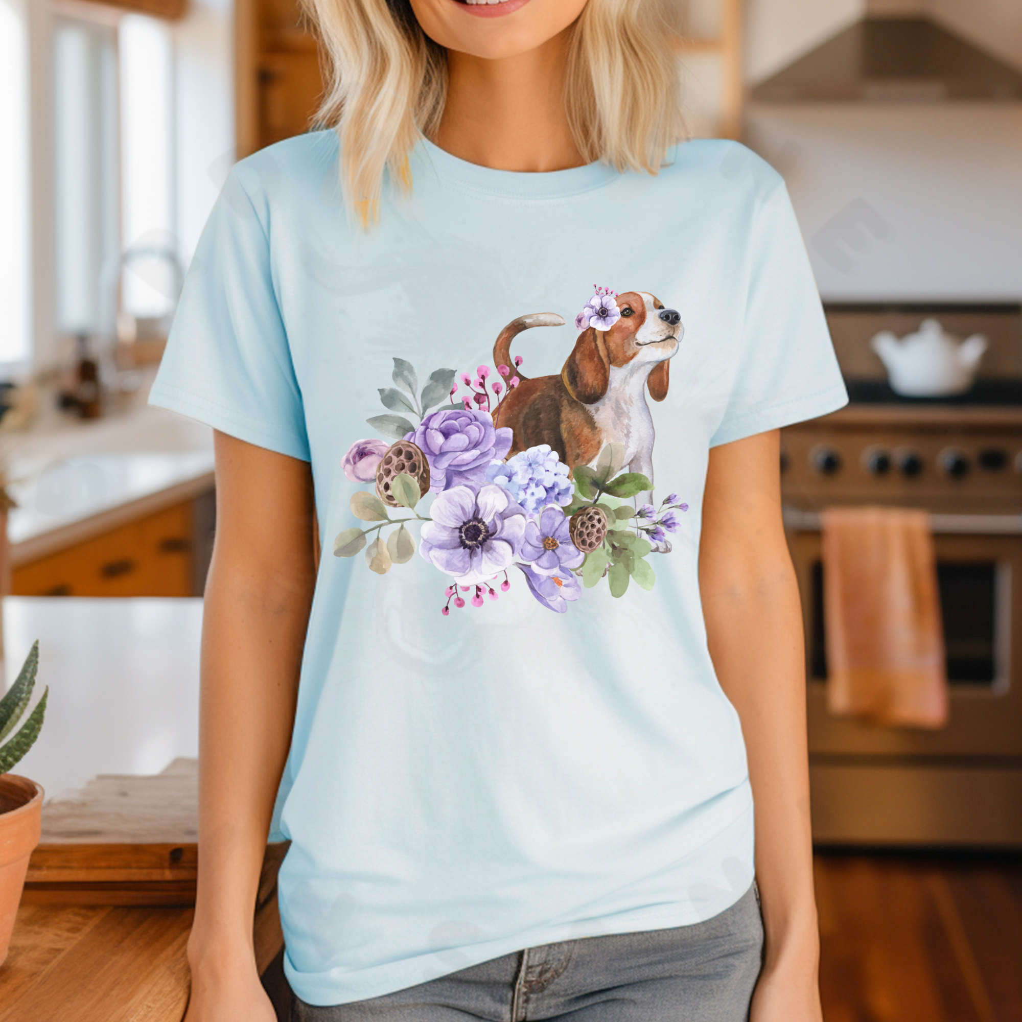 a woman standing in a kitchen wearing a heather ice blue beagle in flowers tee