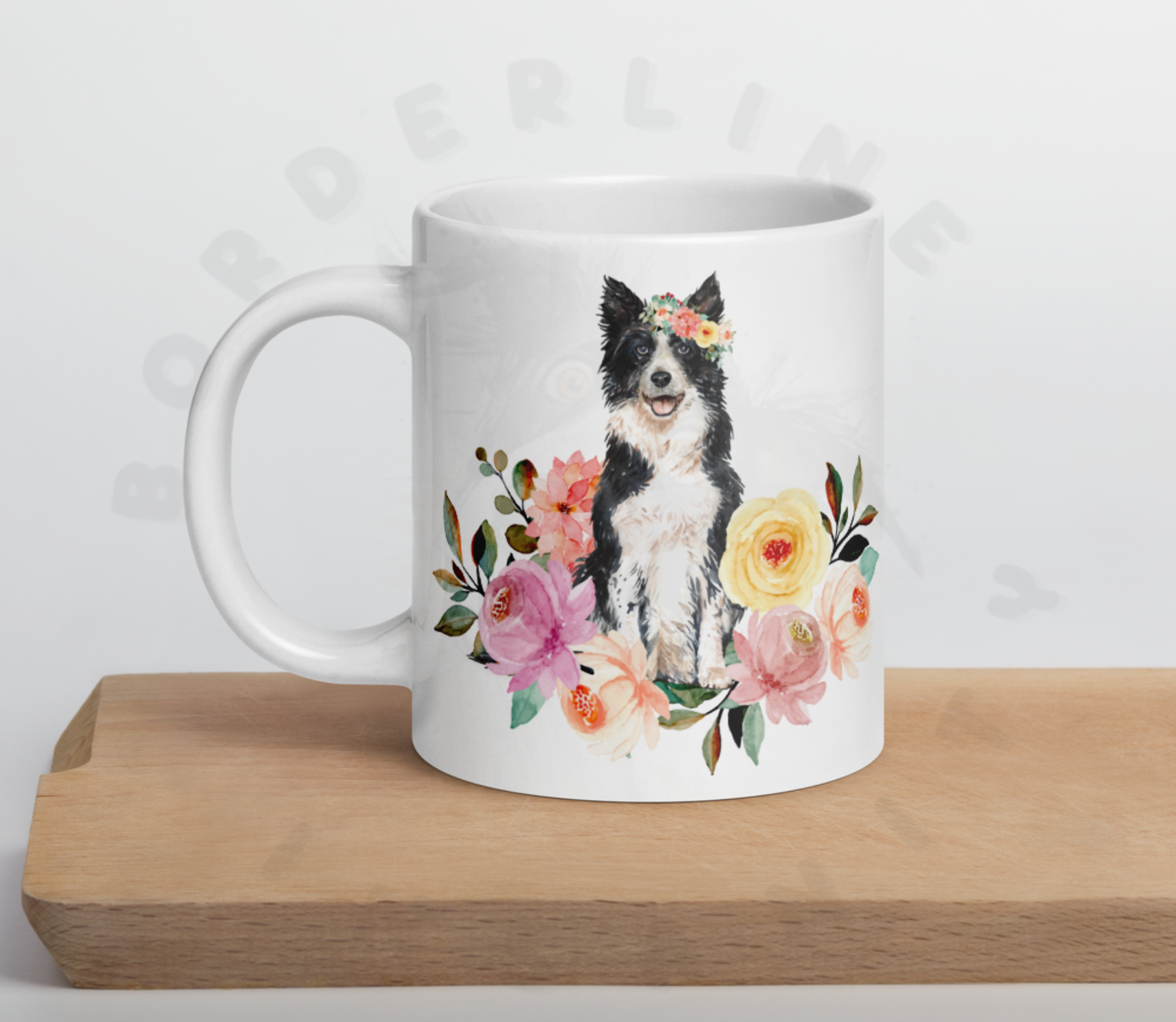 border collie in flowers mug sitting on a cutting board