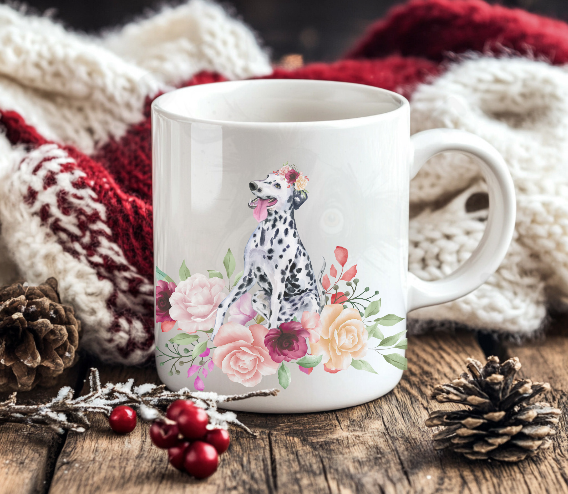 dalmatian in flowers mug in front of a red and white christmas blanket with holly berries and pine cones