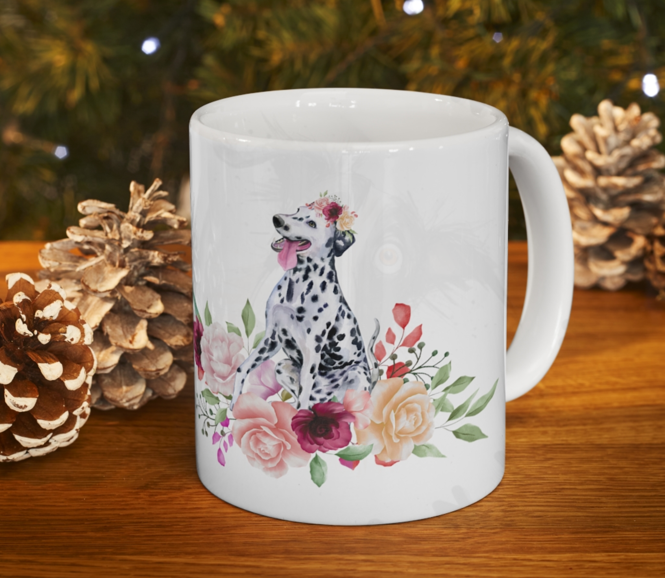 dalmatian in flowers mug in front of gold pine cones