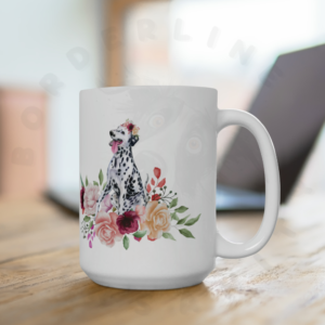 dalmatian in flowers mug sitting on a desk in front of a laptop