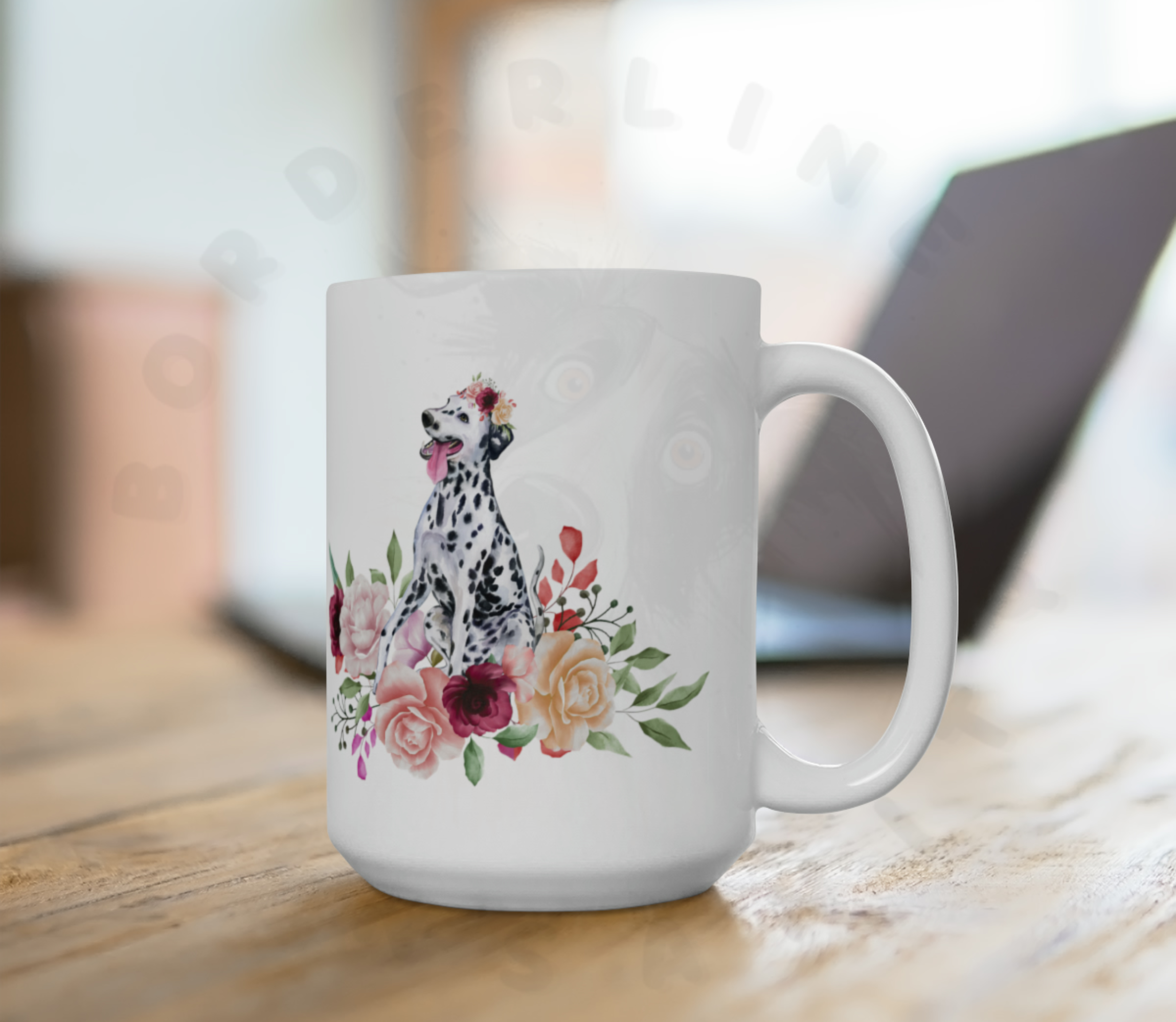 dalmatian in flowers mug sitting on a desk in front of a laptop