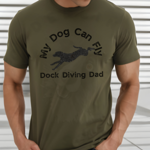 a man wearing an army green my dog can fly dock diving dog tee with a silhouette of a diving dog in the middle