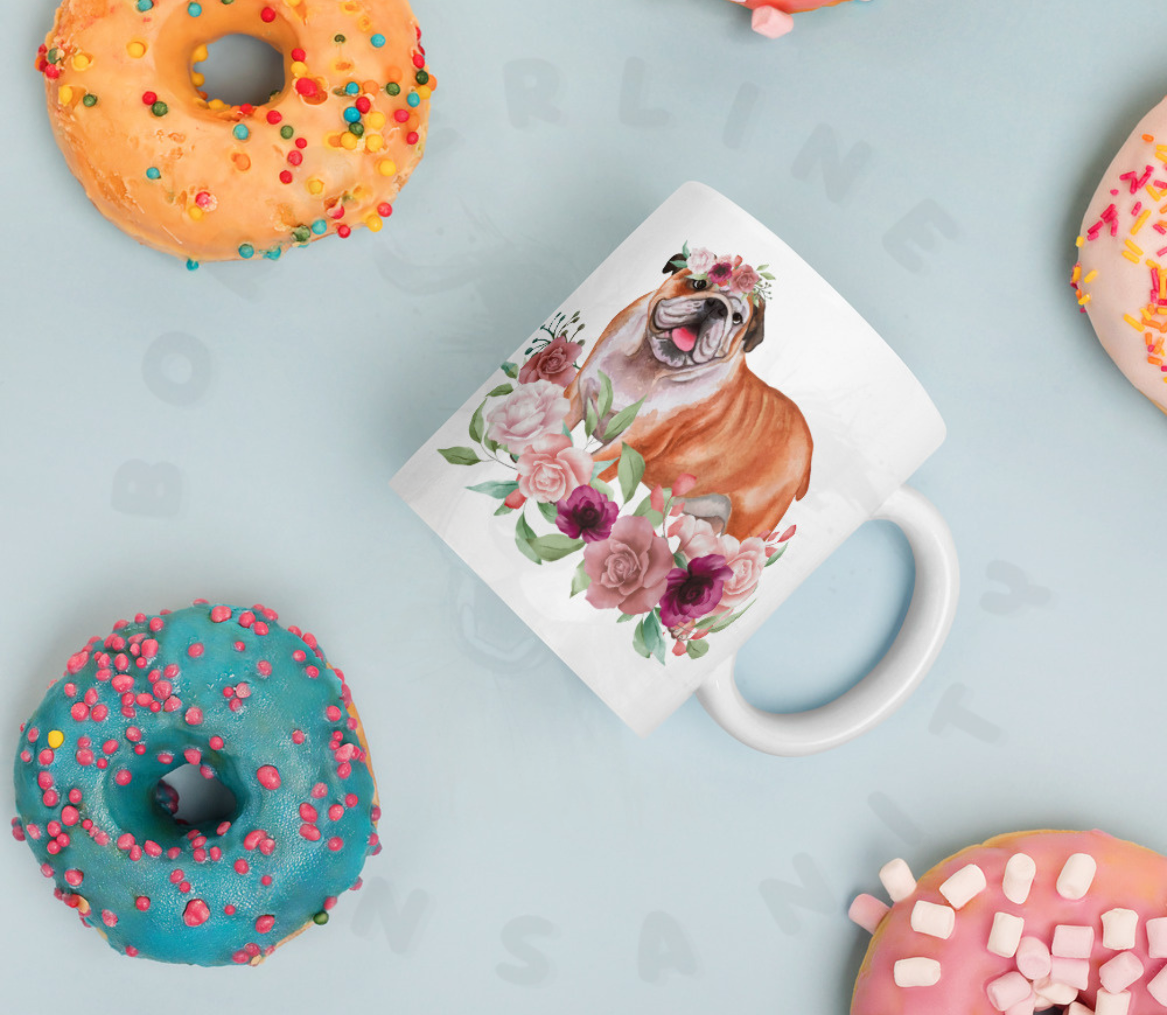 English bulldog in flowers mug surrounded by colorful donuts