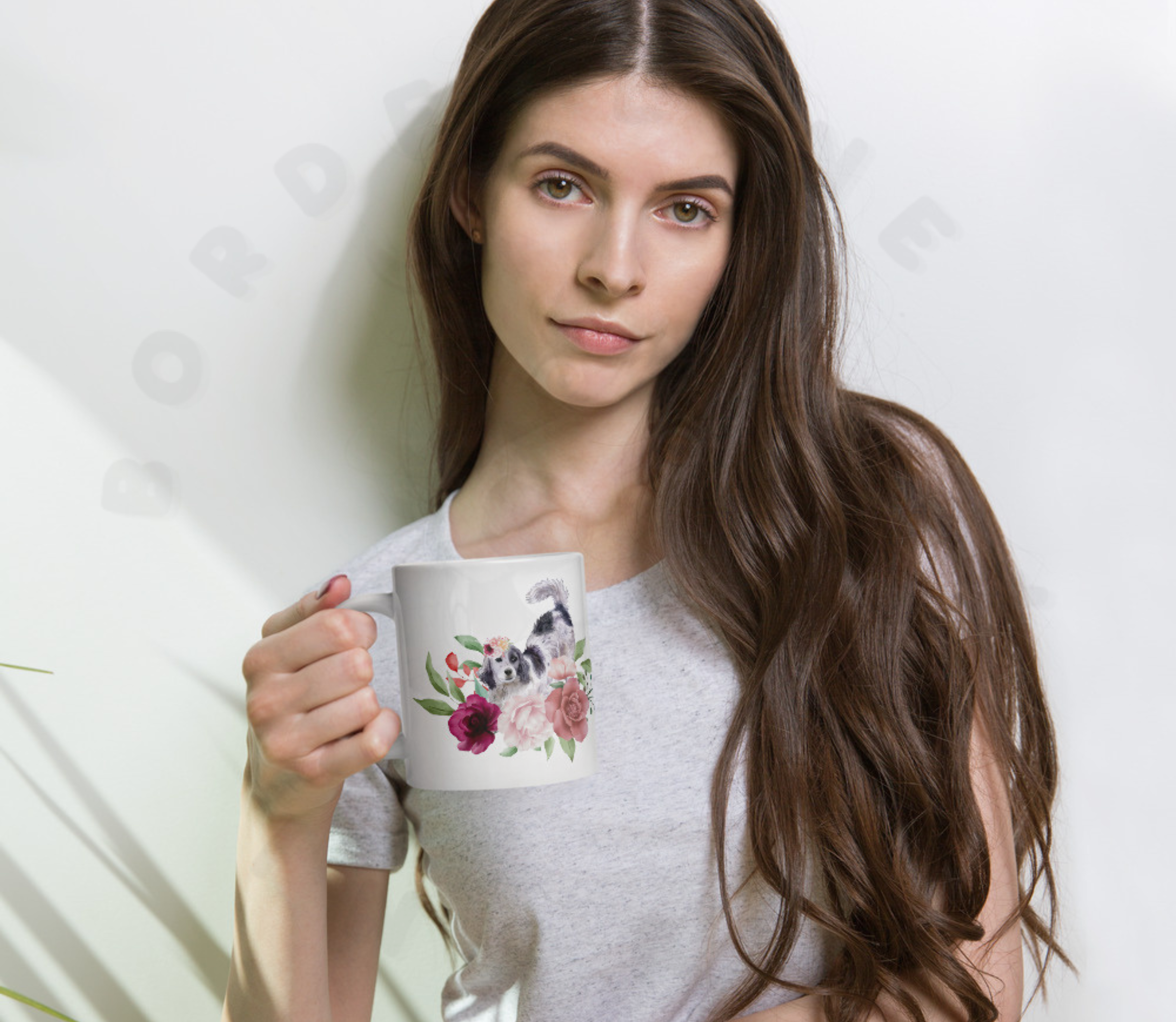 A woman holding an english setter floral ceramic mug with pink roses and watercolor flowers