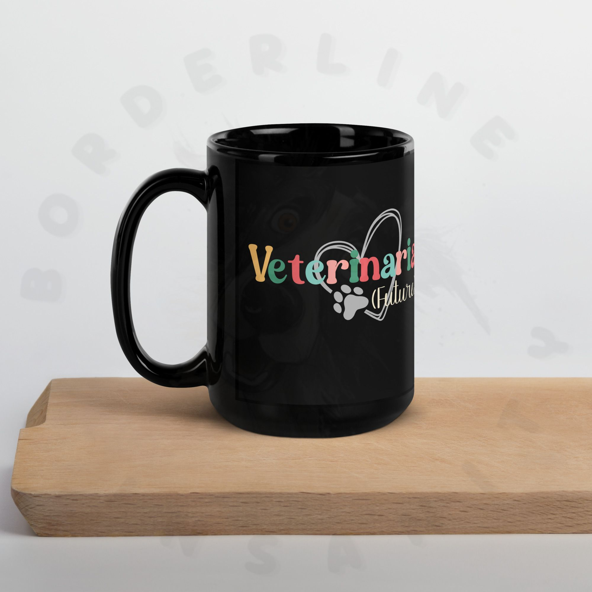15oz black ceramic future veterinarian mug on a cutting board