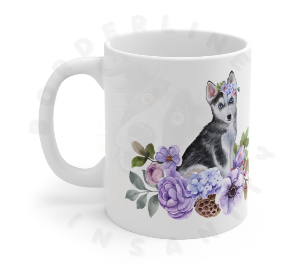 husky puppy in flowers mug in front of a white background