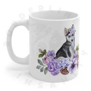 husky puppy in flowers mug in front of a white background