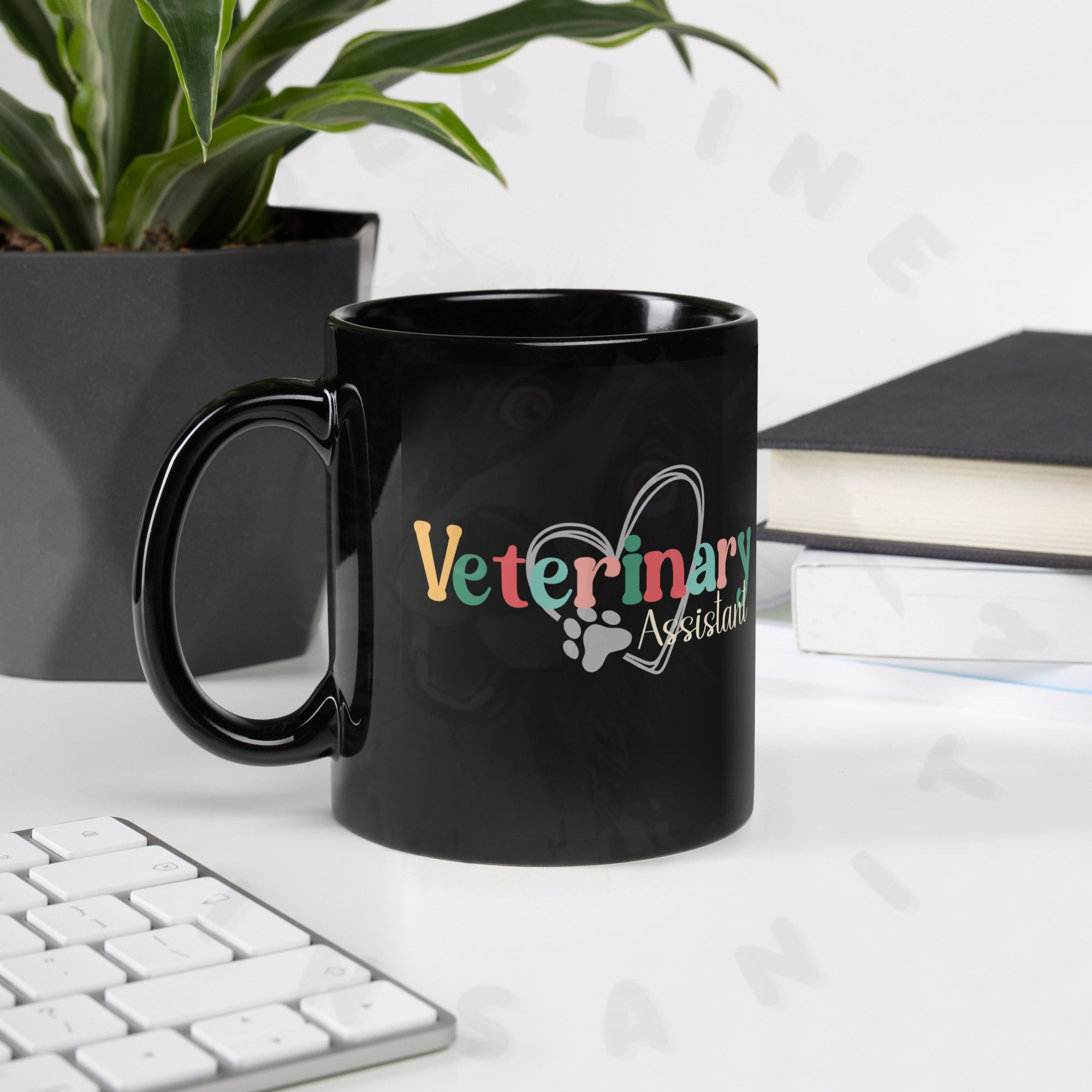11oz veterinary assistant black ceramic mug on a desk with a plant and a keyboard