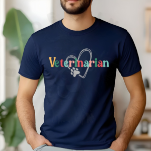 a man standing in front of plants wearing a navy veterinarian tee with a heart and paw print