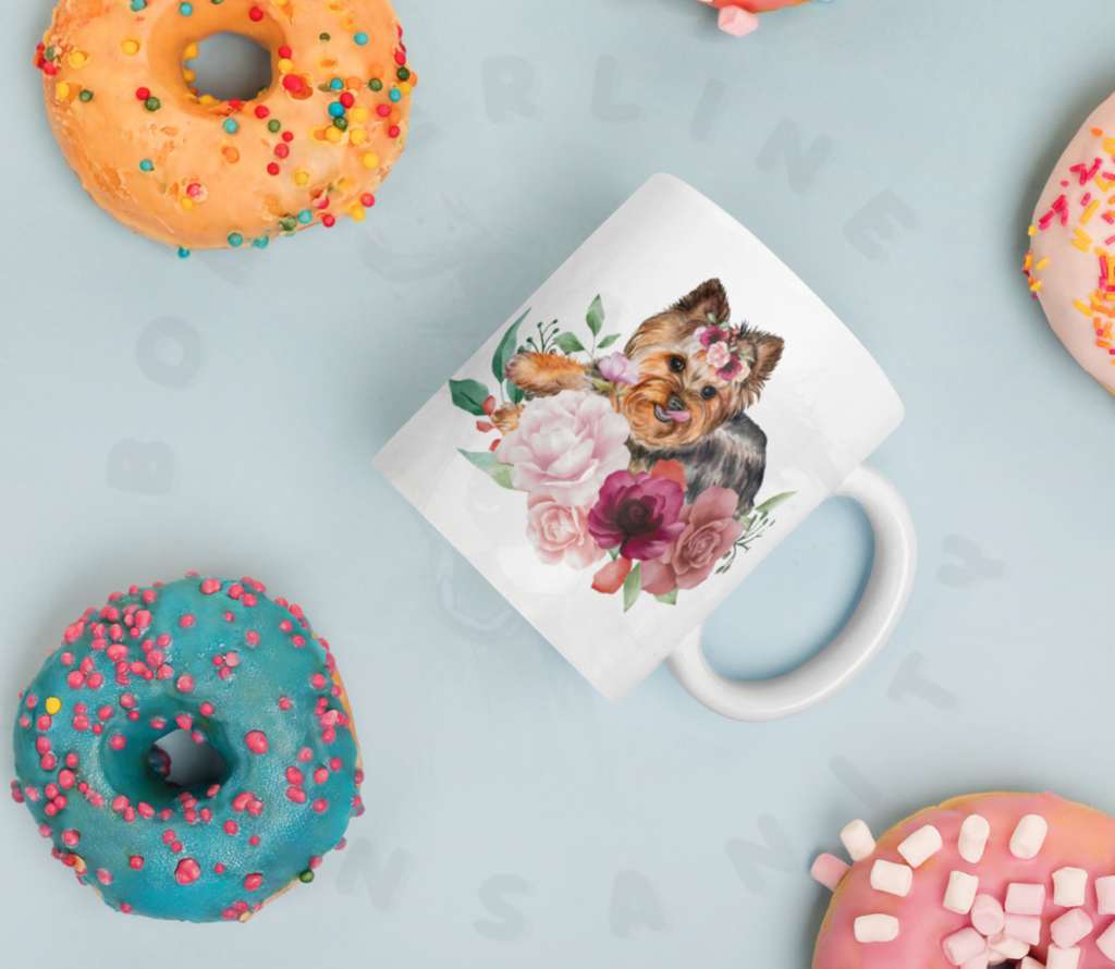 Yorkshire Terrier floral ceramic mug with pink roses and watercolor flowers lying among donuts