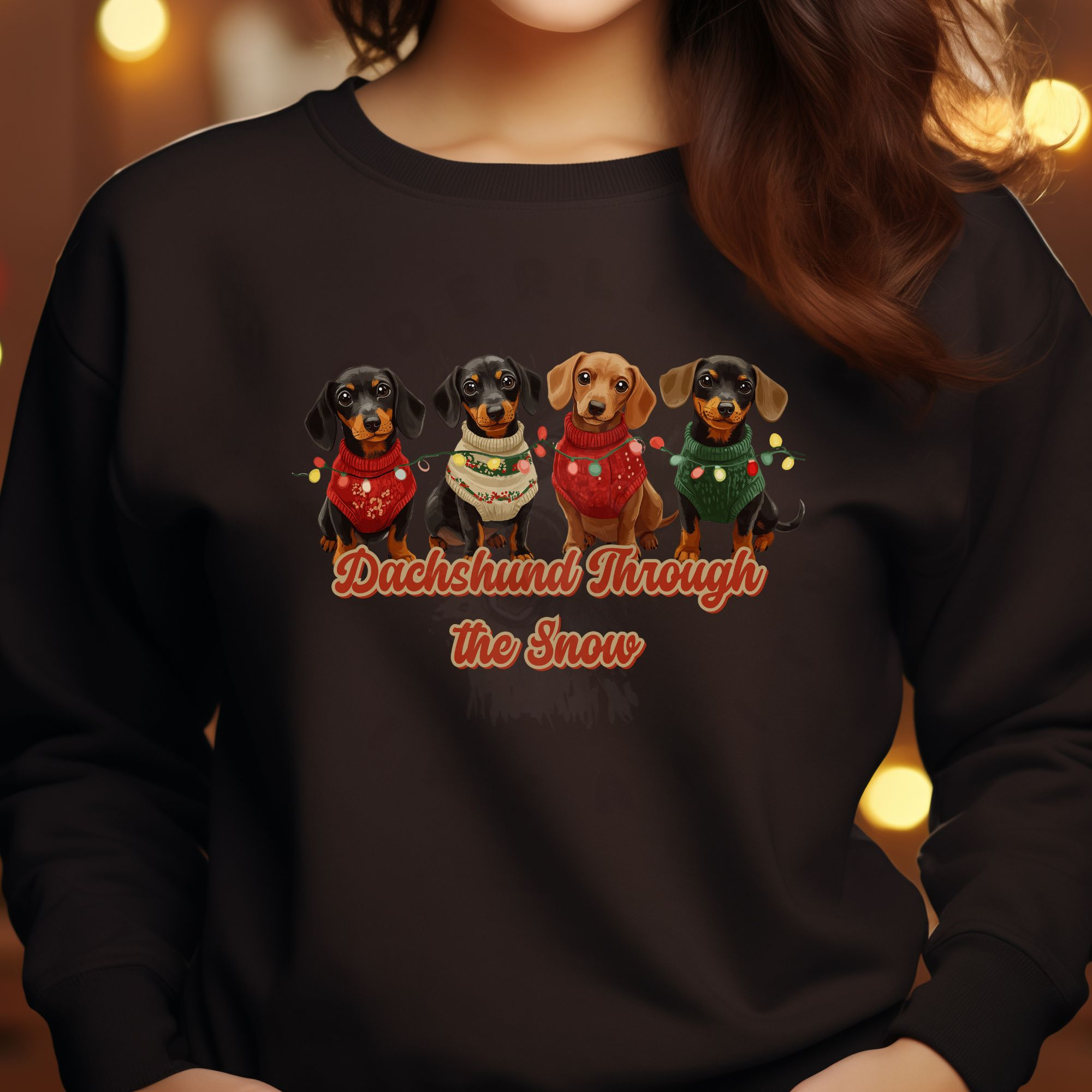 a christmas lights background with a woman wearing a brown dachshund through the snow sweatshirt featuring 4 dachshunds wearing christmas sweaters and tangled in christmas lights