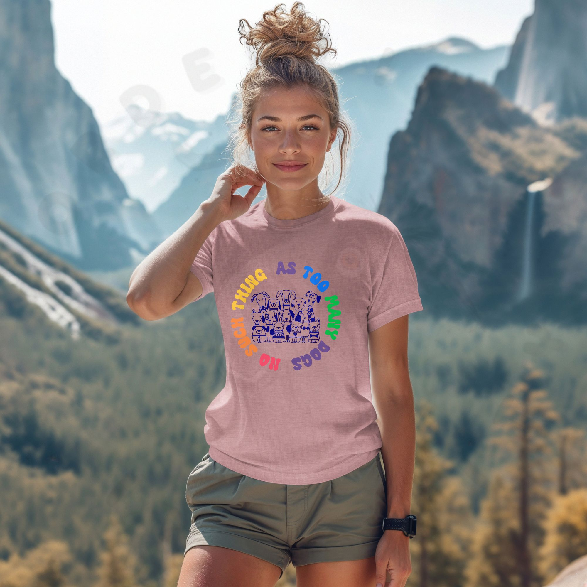 Dusty pink shirt with illustration of many dogs and rainbow text that says “No such thing as too many dogs.”