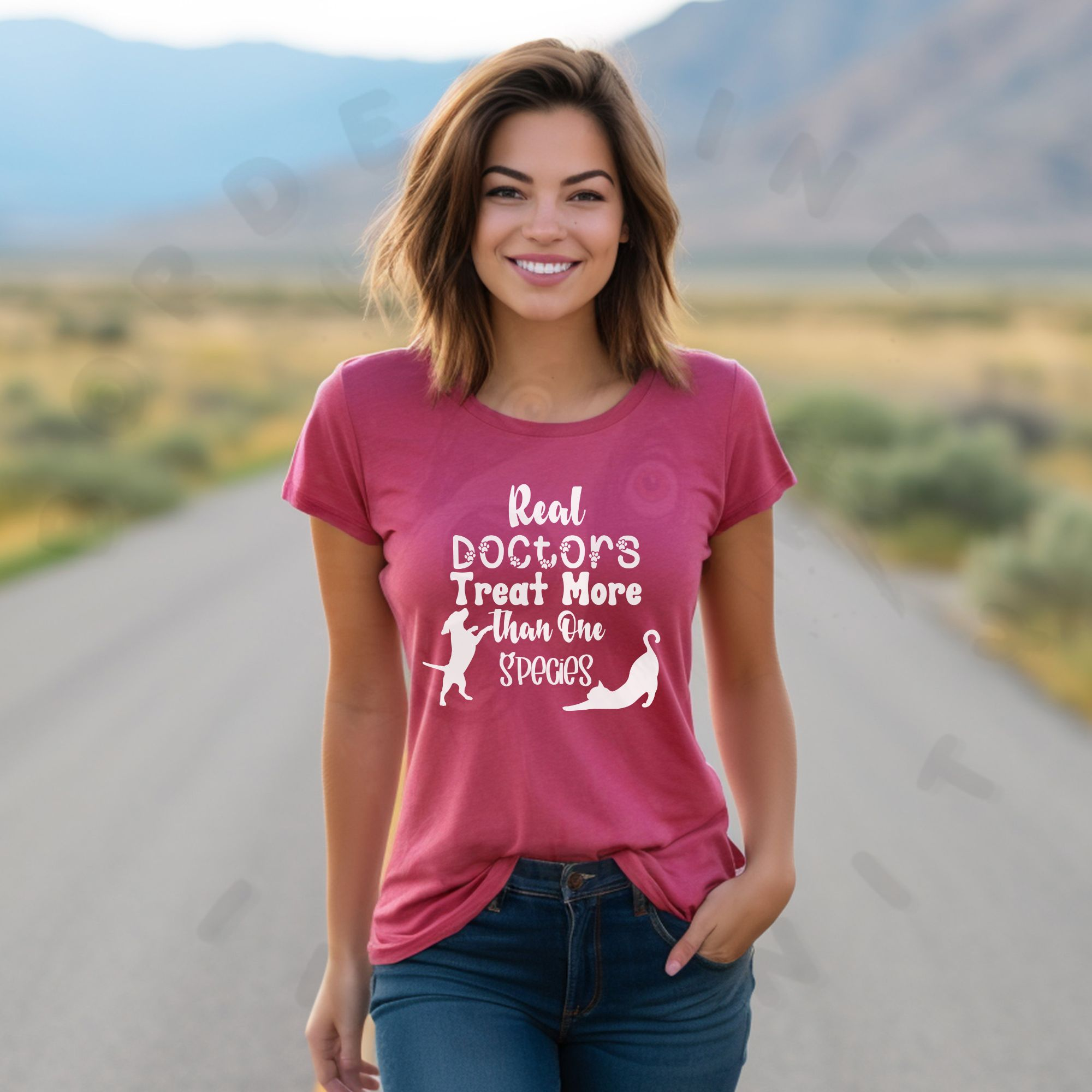 a woman standing in the middle of the road wearing a heather raspberry t-shirt that says real doctors treat more than one species in various fonts