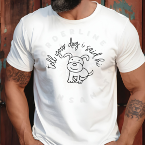 a man leaning against a wall wearing a white tee that says tell your dog i said hi with a hand-drawn style dog graphic