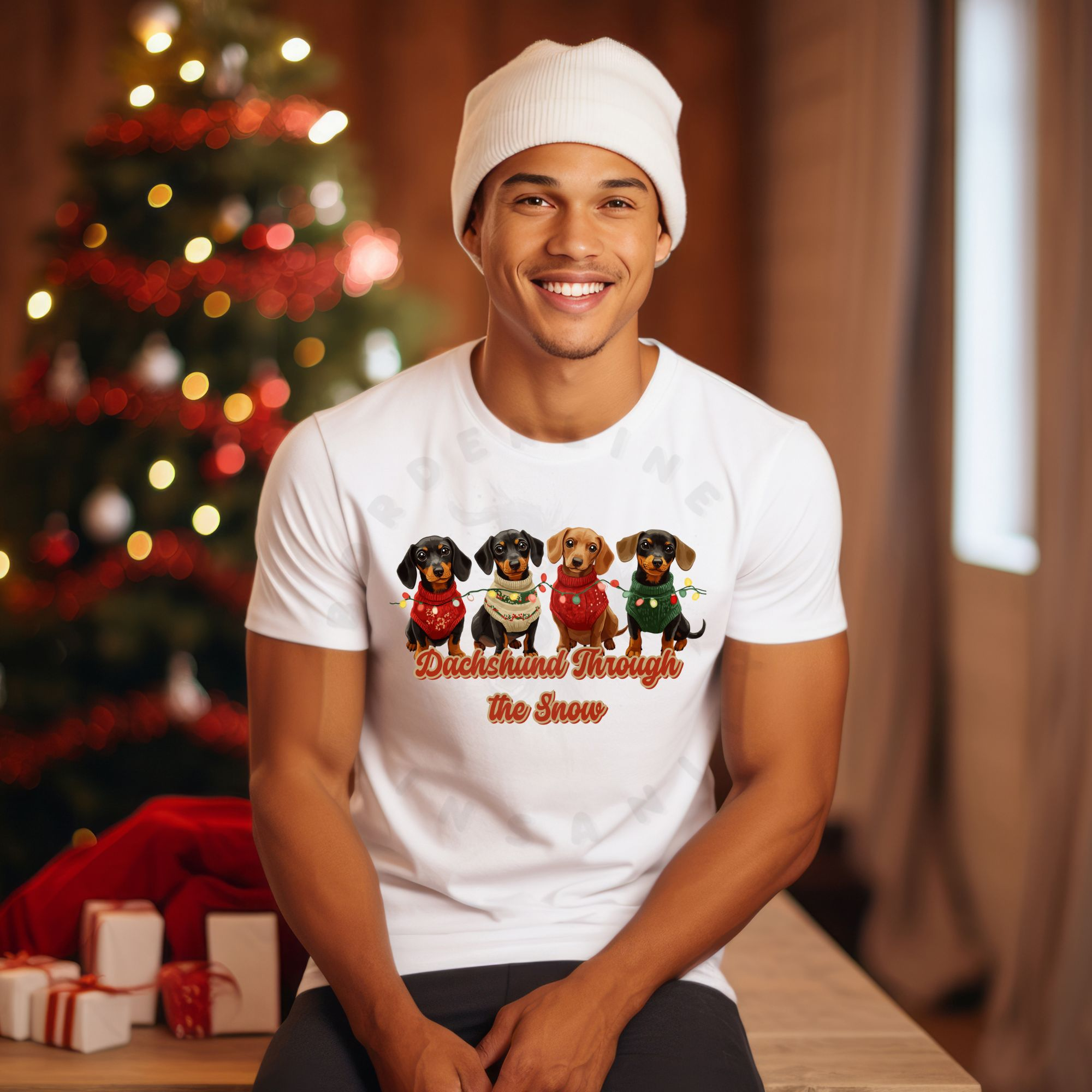 a man wearing a hat sitting in front of a christmas tree wearing a white dachshund through the snow t-shirt featuring 4 dachshunds wearing christmas sweaters and tangled in christmas lights