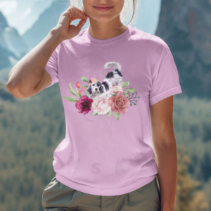 a woman standing in front of a mountain backdrop wearing a lilac tee featuring an english setter in flowers