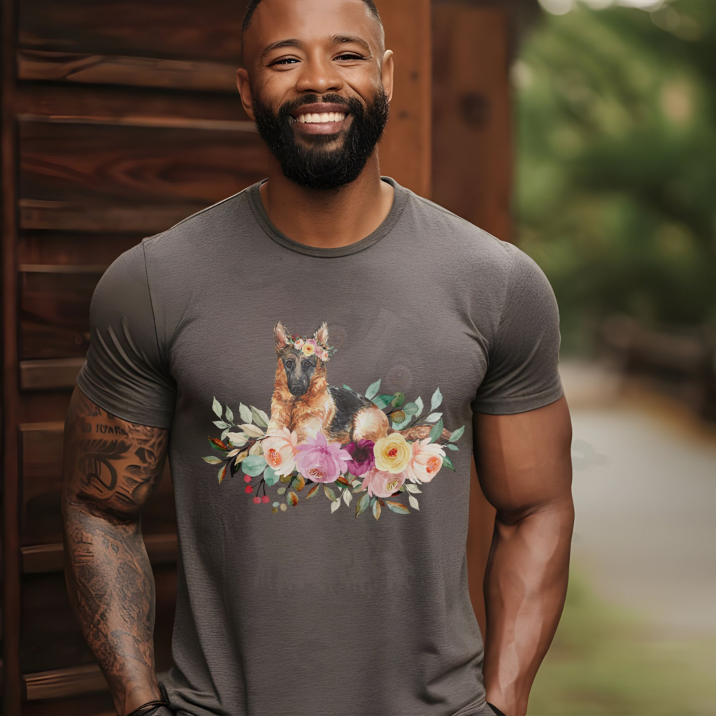 a man standing next to a cabin wearing a pebble brown tee with a graphic of a german shepherd in flowers