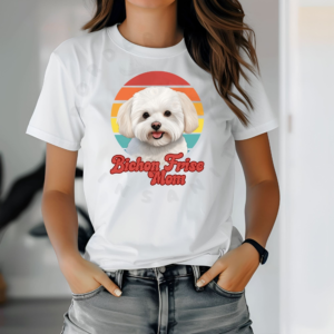 a woman wearing a white tee featuring a retro sunset design and a bichon frise with the words bichon frise mom in retro script
