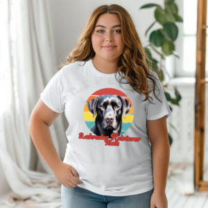 a woman wearing a white tee featuring a retro sunset design with a black lab and the words labrador retriever mom in retro script