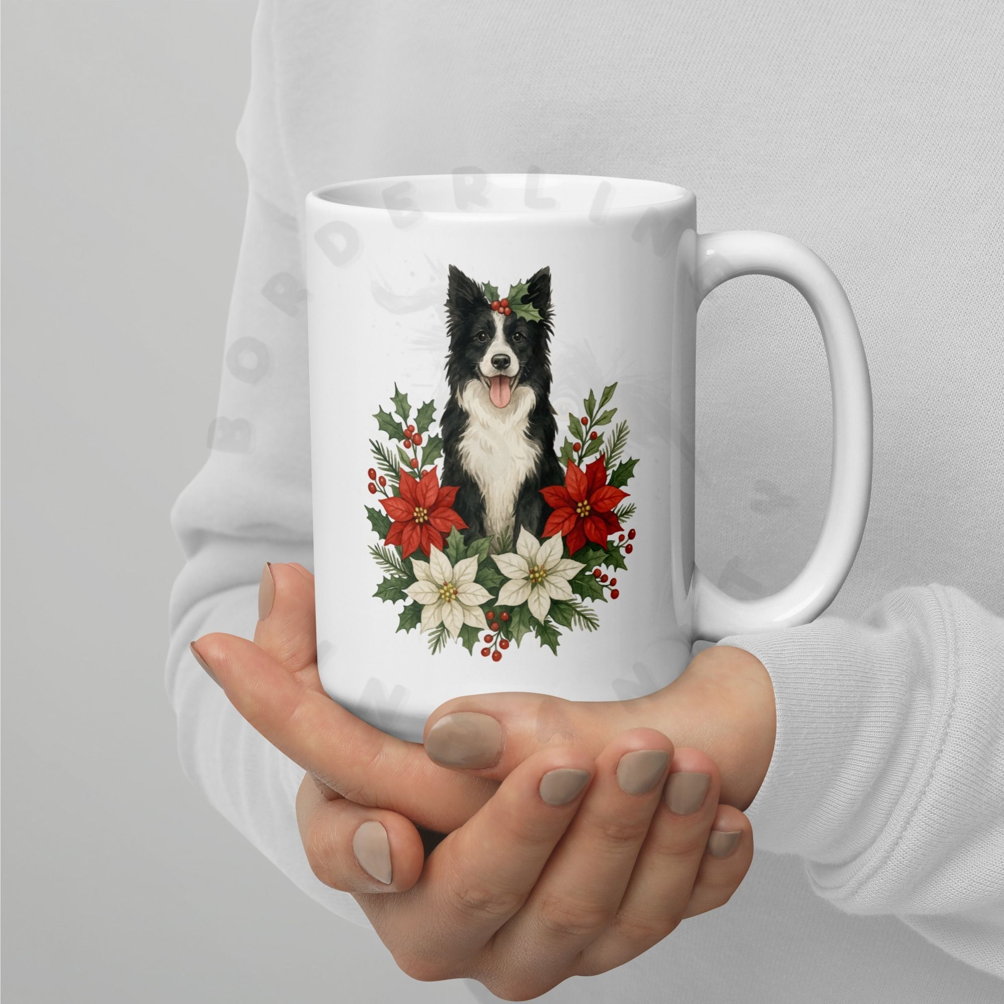 Hands holding Border Collie Christmas coffee mug with festive floral design and holiday botanicals