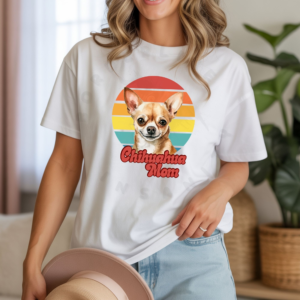 a woman wearing a white tee featuring a retro sunset design and a chihuahua with the words chihuahua mom in retro script