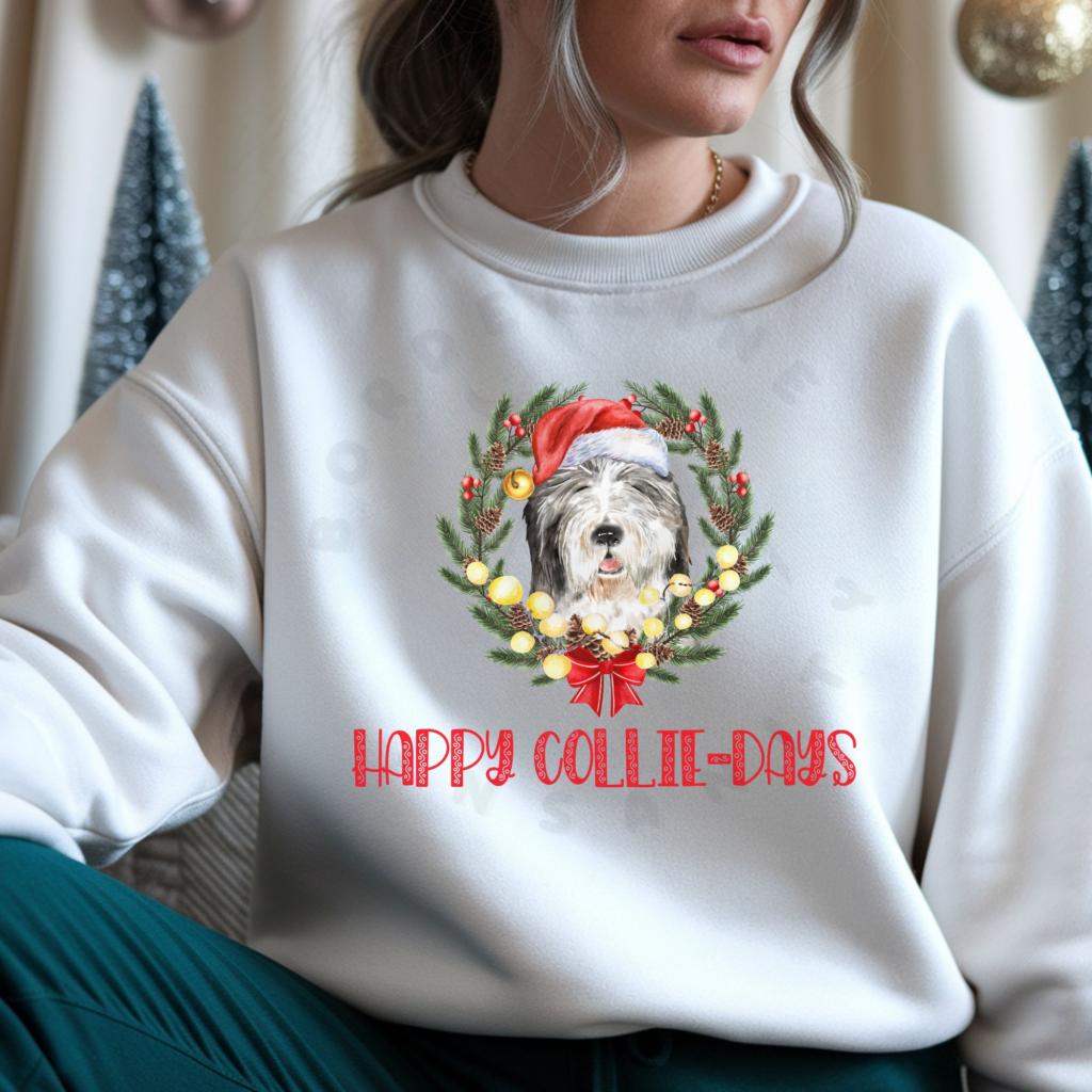 Bearded collie wearing Santa hat in Christmas wreath with Happy Collie-Days text on sweatshirt