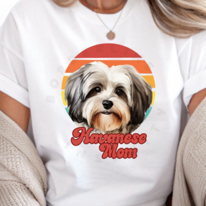 a woman wearing a white tee featuring a retro sunset design with a havanese and the words havanese mom in retro script