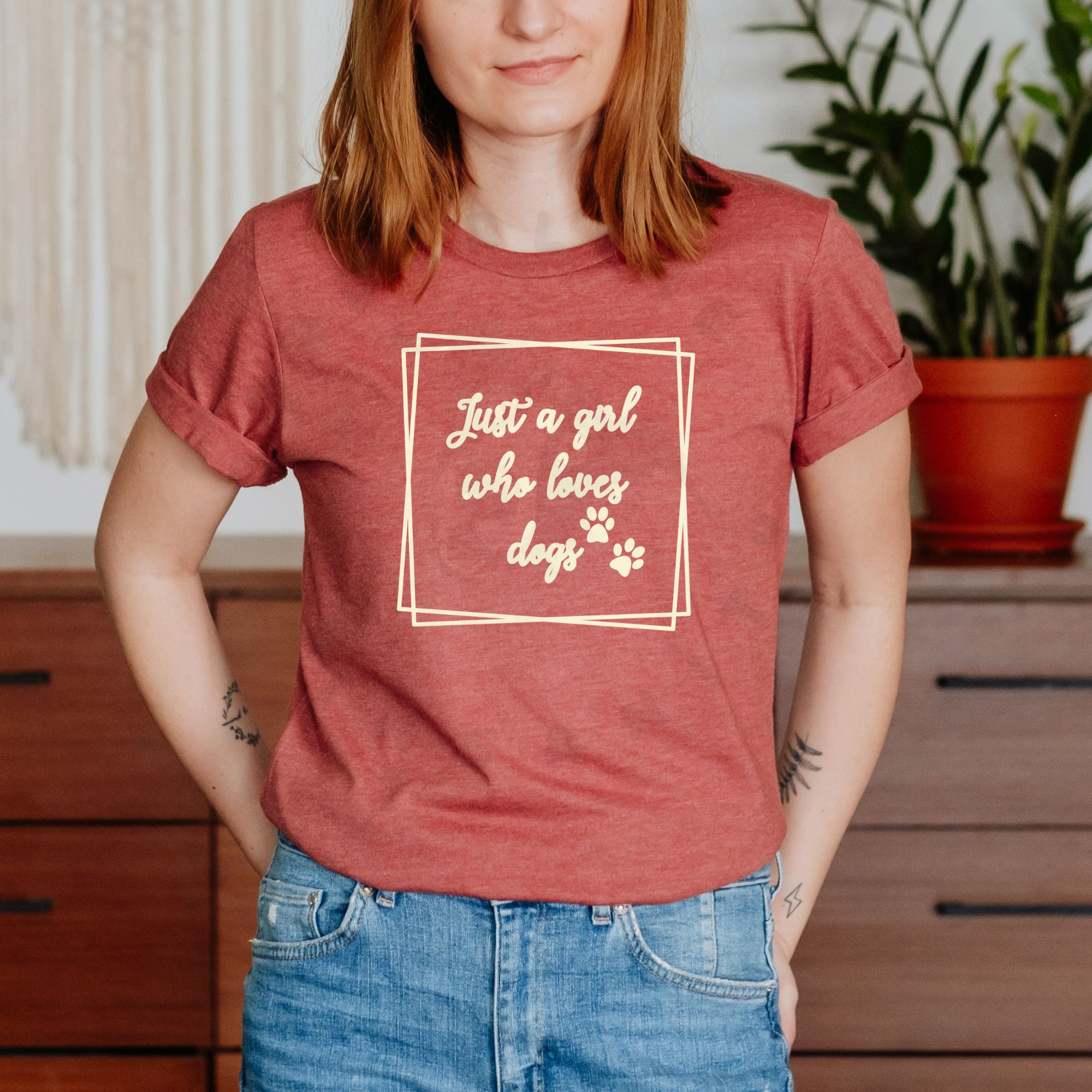ust a girl who loves dogs text with paw prints in sketchy frame on heather clay t-shirt