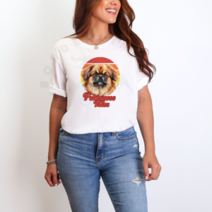 a woman wearing a white tee that features a retro sunset design with a pekingese and the words pekingese mom in retro script