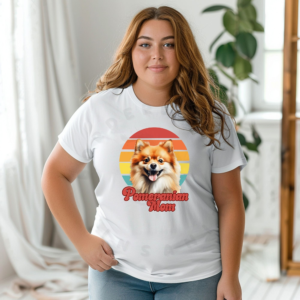 a woman wearing a white tee featuring a retro sunset design and a pomeranian, with the words pomeranian mom in retro script