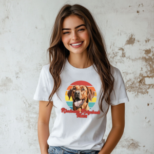 a woman wearing a white tee featuring a retro sunset design and a rhodesian ridgeback with the words rhodesian ridgeback mom in retro script