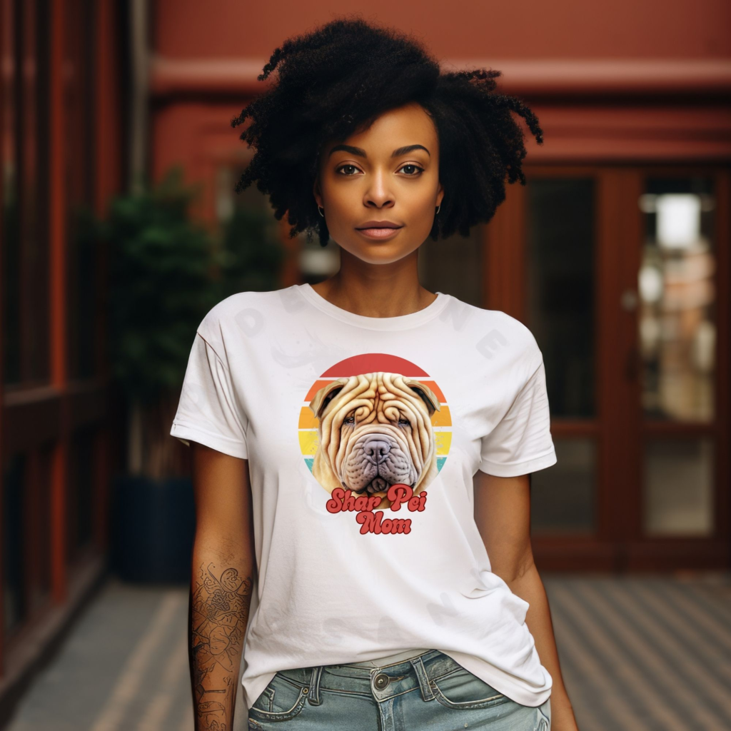 a woman wearing a white tee featuring a retro sunset design with a shar pei and the words shar pei mom in retro script