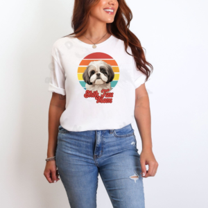 a woman wearing a white tee featuring a retro sunset design with a shih tzu and the words shih tzu mom in retro script