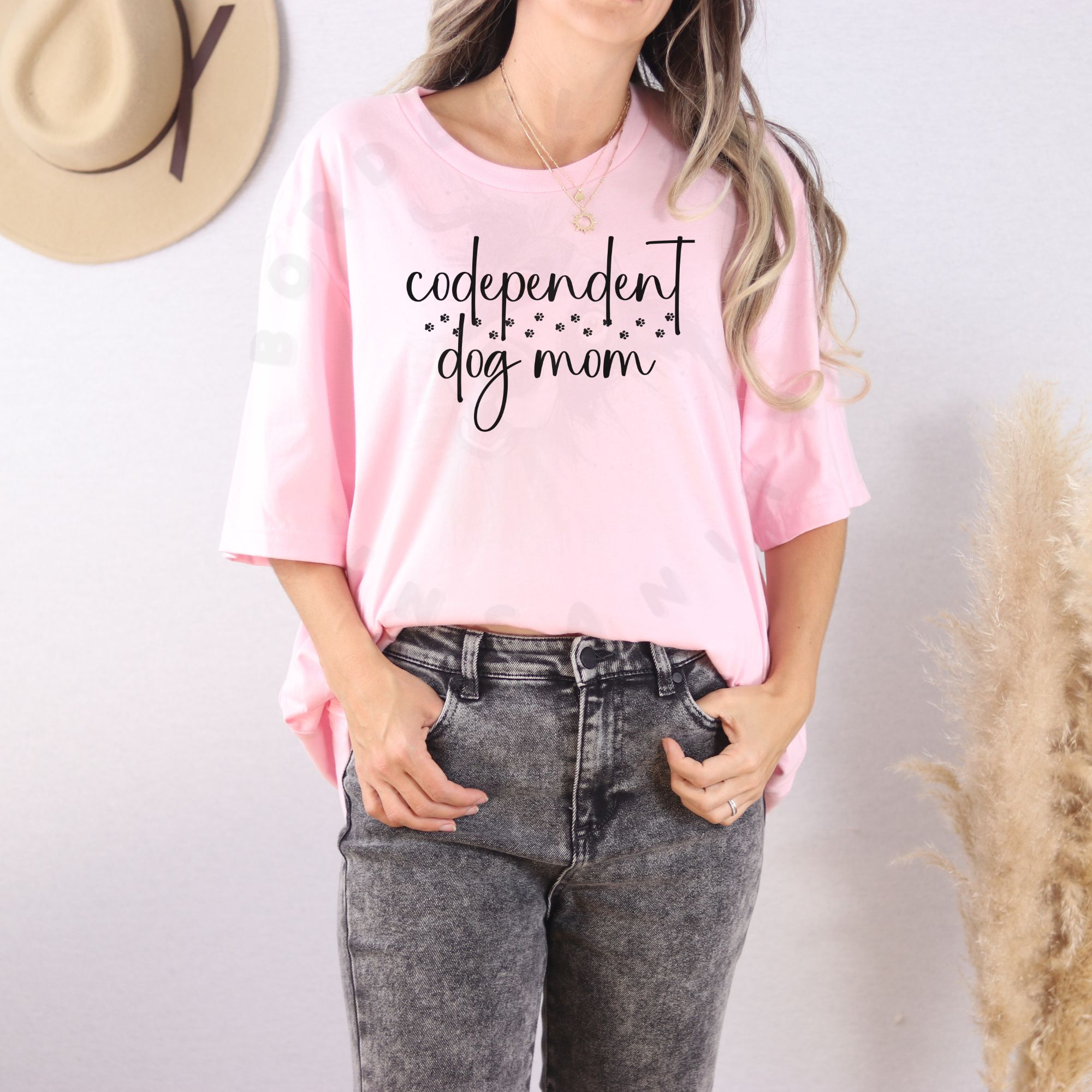 Codependent dog mom shirt design with handwritten text and paw prints for funny dog lover apparel