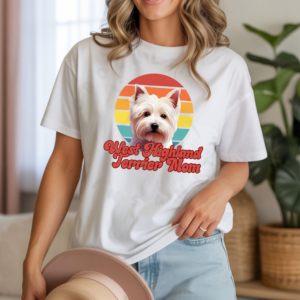 a woman wearing a white tee featuring a retro sunset and a west highland terrier with the words west highland terrier mom in retro script