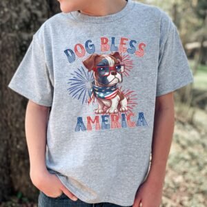 a boy wearing a sport grey tee featuring a graphic of a cartoon style boxer wearing an american flag bandana with the words dog bless america in red and blue