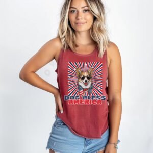 a woman wearing a crimson tank with a patriotic background and an image of a corgi in an american flag bandana and sunglasses that says dog bless america