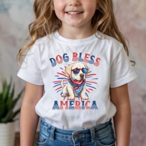 a girl wearing a white tee featuring a graphic of a cartoon style labrador wearing an american flag bandana with the words dog bless america in red and blue