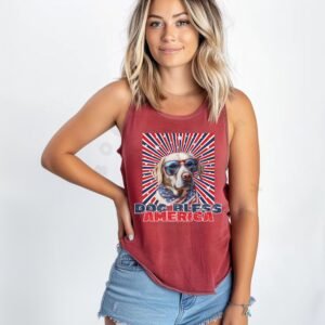 a woman wearing a crimson tank with a patriotic background and an image of a labrador in an american flag bandana and sunglasses that says dog bless america
