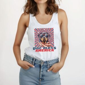 a woman wearing a white tank with a patriotic background and an image of a rottweiler in an american flag bandana and sunglasses that says dog bless america