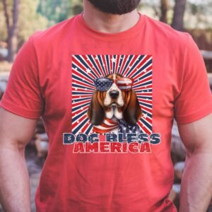 a man wearing a heather red tee with a patriotic background and an image of a basset hound in an american flag bandana and sunglasses that says dog bless america