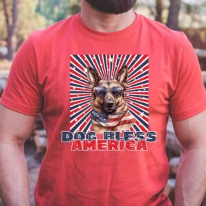 a man wearing a heather red tee with a patriotic background and an image of a German Shepherd in an american flag bandana and sunglasses that says dog bless america