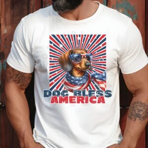 a man standing against a wood paneled wall wearing a white tee with a patriotic background and an image of a dachshund in an american flag bandana and sunglasses that says dog bless america