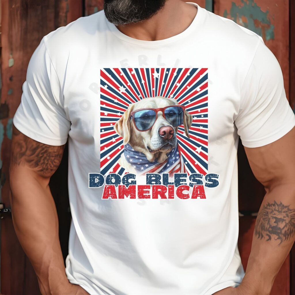 a man standing against a wood paneled wall wearing a white tee with a patriotic background and an image of a labrador in an american flag bandana and sunglasses that says dog bless america